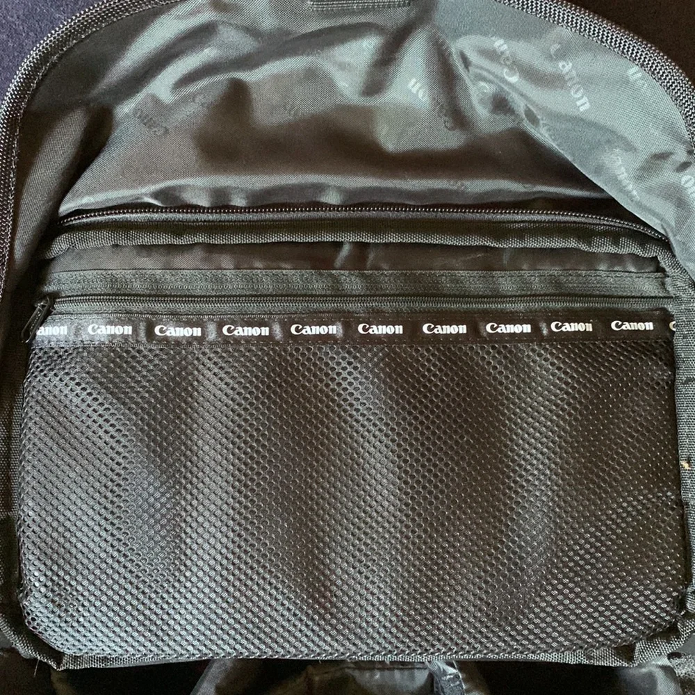 Canon camera bag with many pockets, zippers, straps, 5 inside compartments. EUC